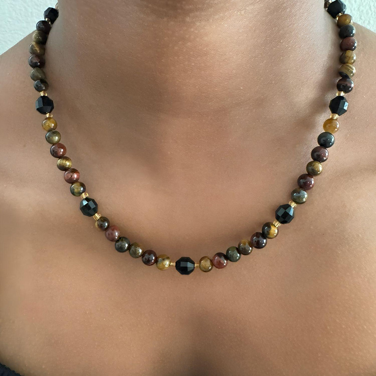 Tiger’s eye and black onyx gemstone beaded necklace with translucent yellow spacer beads and gold-filled accents